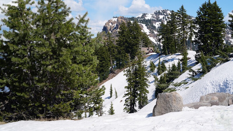 Crater Lake snow on the mountains and evergreen trees
